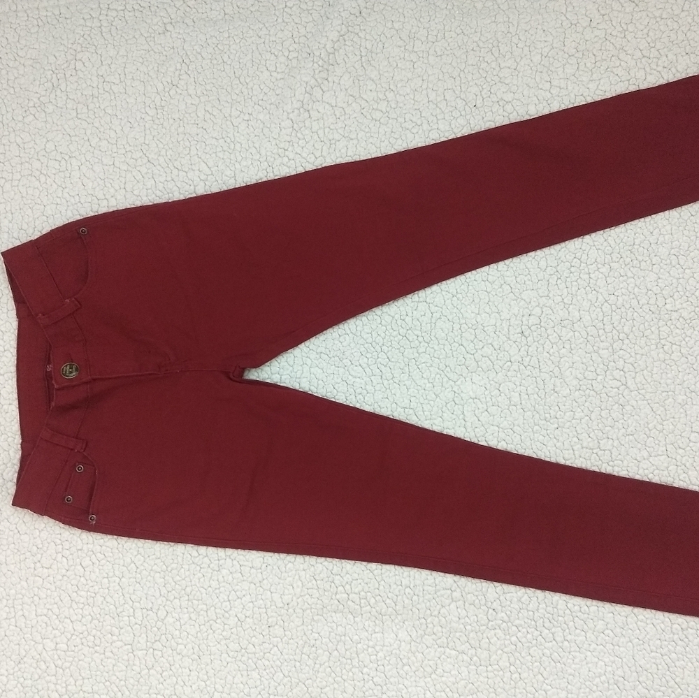 Dark red jeans.